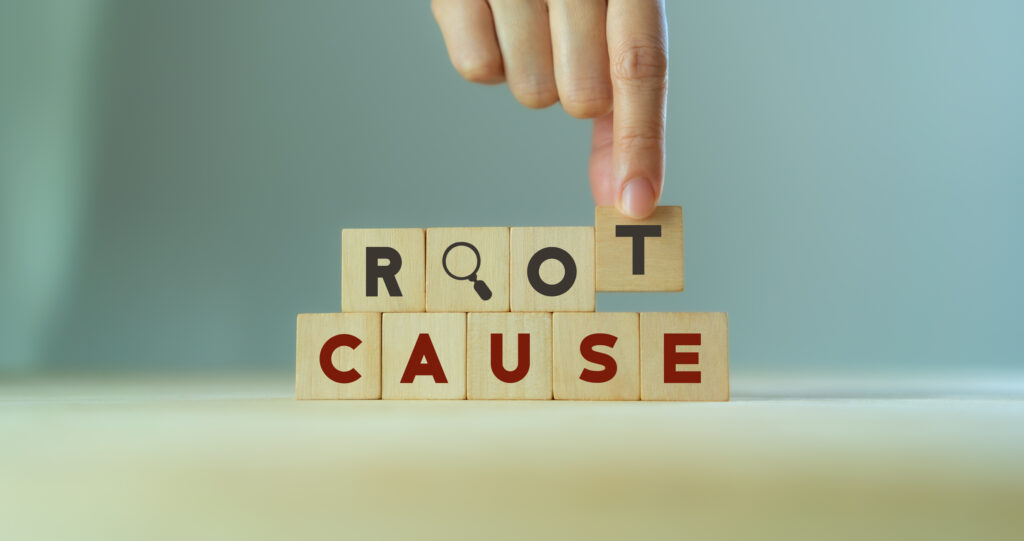 Root Cause spelt out on blocks that are stacked on top of each other.
