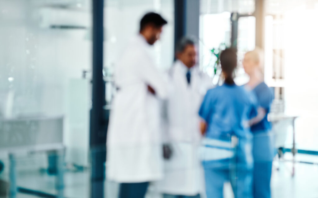 Defocused shot of a group of medical practitioners working in a hospital.